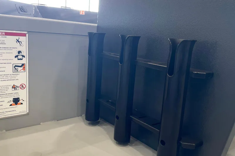 Slide: The Image of 2026 Crestliner 1870 Retriever FCC boat interior with steering console and storage compartments. - 13