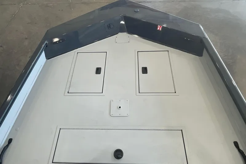 Slide: The Image of 2026 Crestliner 1870 Retriever FCC boat interior with seating and steering console. - 14