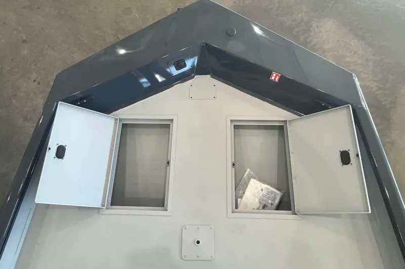 Slide: The Image of 2026 Crestliner 1870 Retriever FCC boat console with steering wheel and control panel. - 16