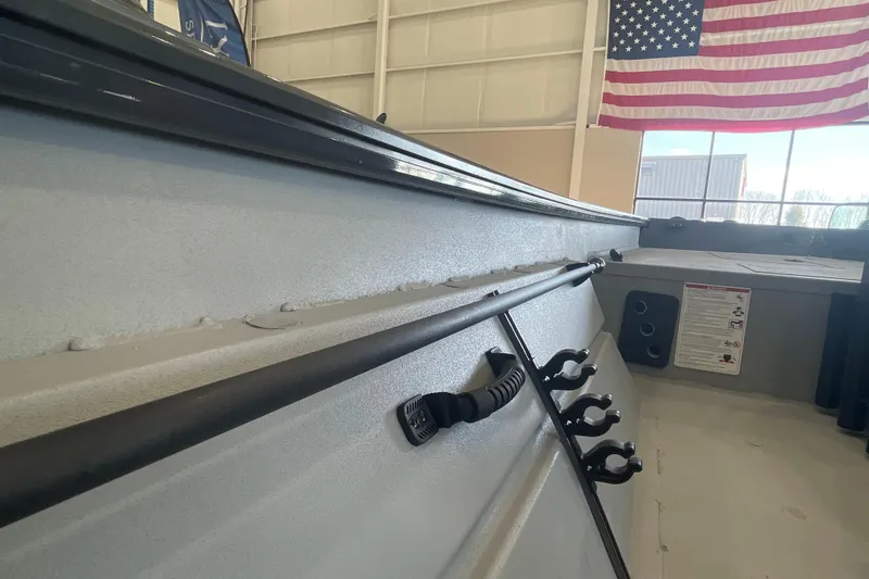 Slide: The Image of 2026 Crestliner 1870 Retriever FCC boat deck with storage compartments. - 19