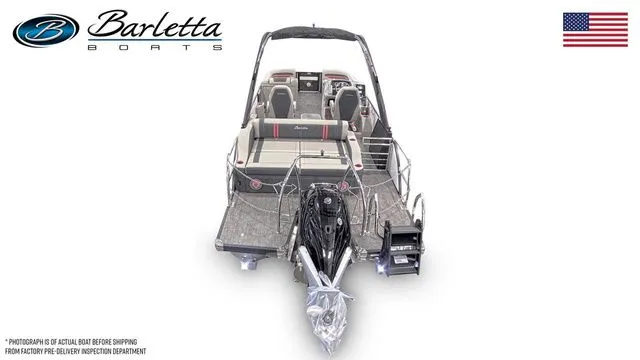 Slide: The Image of 2026 Barletta Corsa 23UCA boat, rear view, showcasing seating and motor, with American flag. - 6