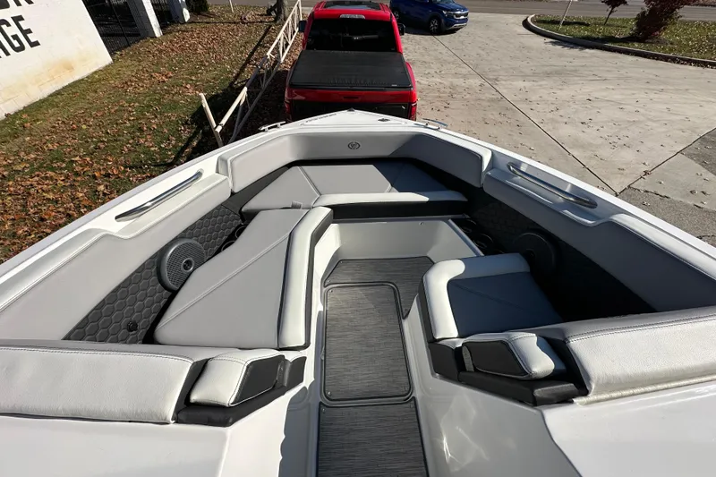 Slide: The Image of 2023 Cobalt R6 Surf boat interior with gray seating and modern design. - 10