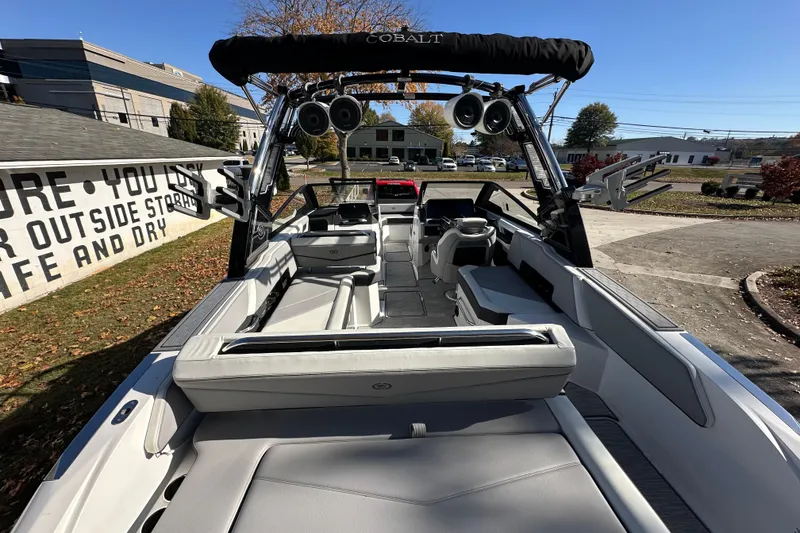 Slide: The Image of 2023 Cobalt R6 Surf boat interior with sleek seating and modern design. - 15