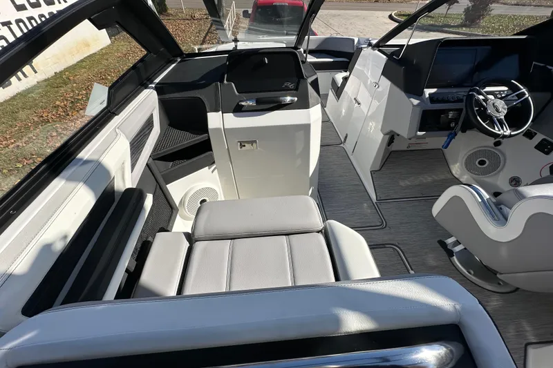 Slide: The Image of 2023 Cobalt R6 Surf boat interior with modern seating and steering wheel. - 9