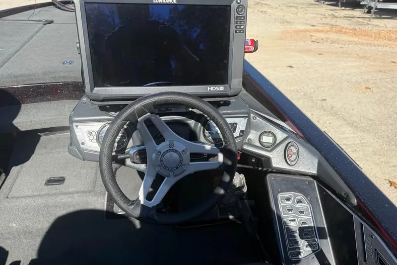 Slide: The Image of 2018 Skeeter FX21 Limited Edition boat dashboard with steering wheel and navigation display. - 10