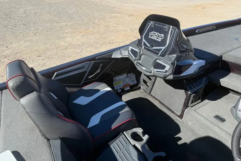 Slide: The Image of 2018 Skeeter FX21 Limited Edition boat interior with sleek seating and modern dashboard. - 11