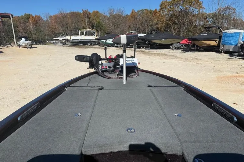 Slide: The Image of 2018 Skeeter FX21 Limited Edition boat in a storage yard with other boats. - 12