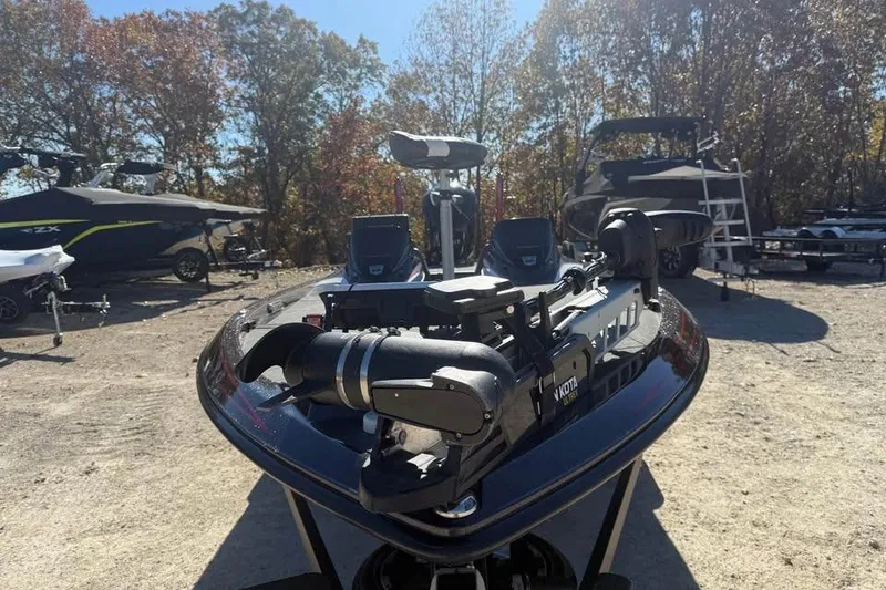Slide: The Image of 2018 Skeeter FX21 Limited Edition boat with advanced equipment, parked outdoors. - 2