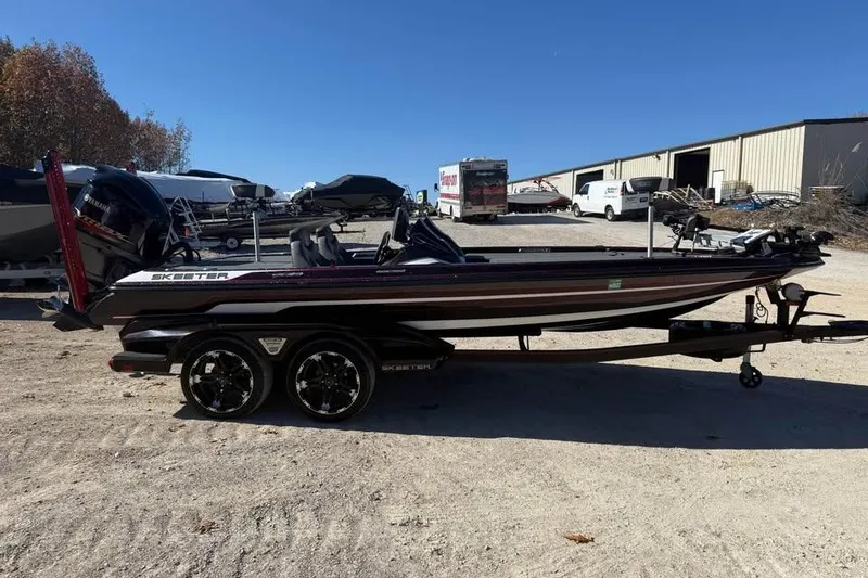 Slide: The Image of 2018 Skeeter FX21 Limited Edition boat on trailer in outdoor storage area. - 4