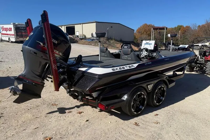 Slide: The Image of 2018 Skeeter FX21 Limited Edition boat with Yamaha engine, parked outdoors on a sunny day. - 5