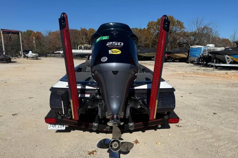 Slide: The Image of 2018 Skeeter FX21 Limited Edition boat with powerful outboard motor in a sunny outdoor setting. - 6