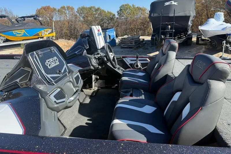 Slide: The Image of 2018 Skeeter FX21 Limited Edition boat interior with sleek seating and modern dashboard. - 8