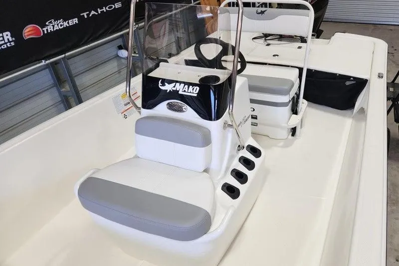 Slide: The Image of 2026 Mako Pro Skiff 17 CC boat interior with seating and steering console. - 13