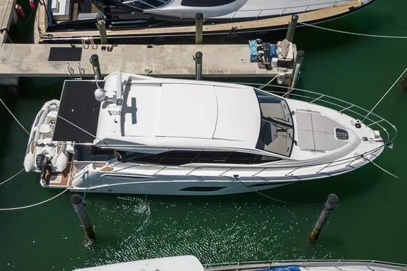 The Image of 2017 Sea Ray Sundancer 460 yacht docked at marina, aerial view. - 0