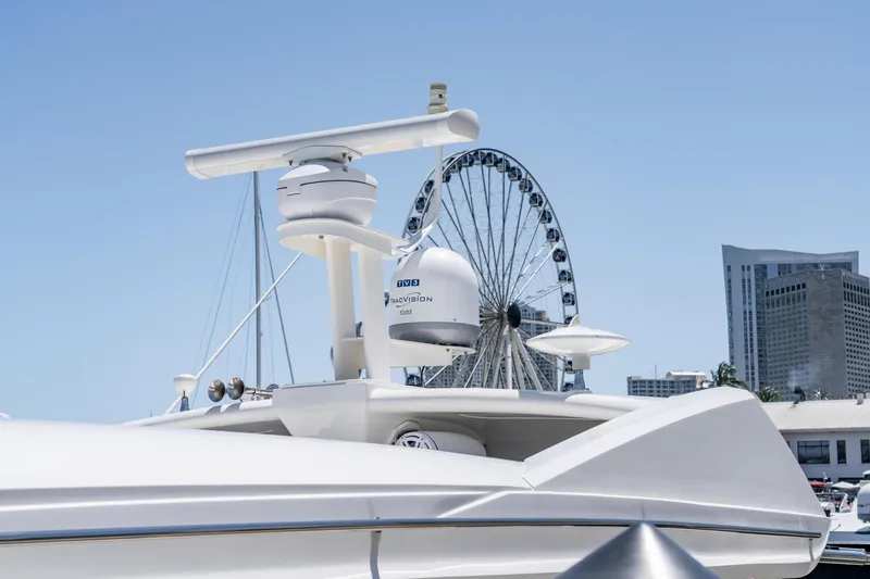 Slide: The Image of 2017 Sea Ray Sundancer 460 yacht with cityscape and Ferris wheel in the background. - 100