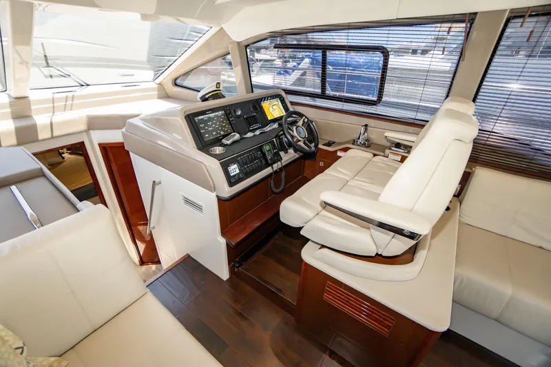 Slide: The Image of Luxurious 2017 Sea Ray Sundancer 460 yacht interior with modern helm and seating. - 22