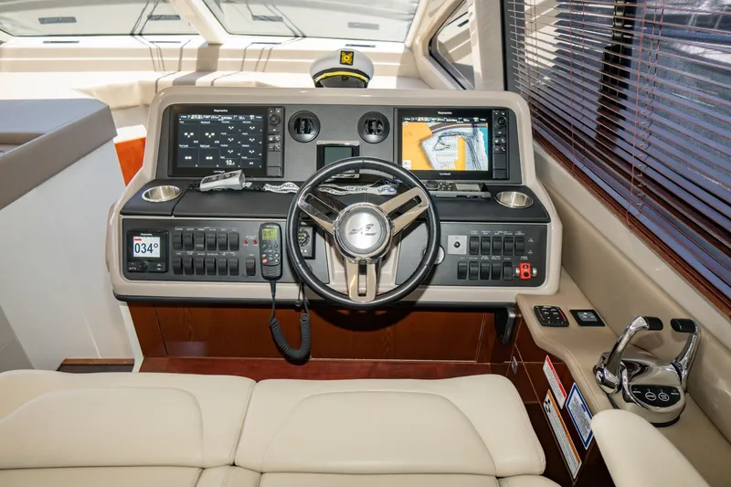 Slide: The Image of 2017 Sea Ray Sundancer 460 helm with advanced navigation displays and controls. - 23
