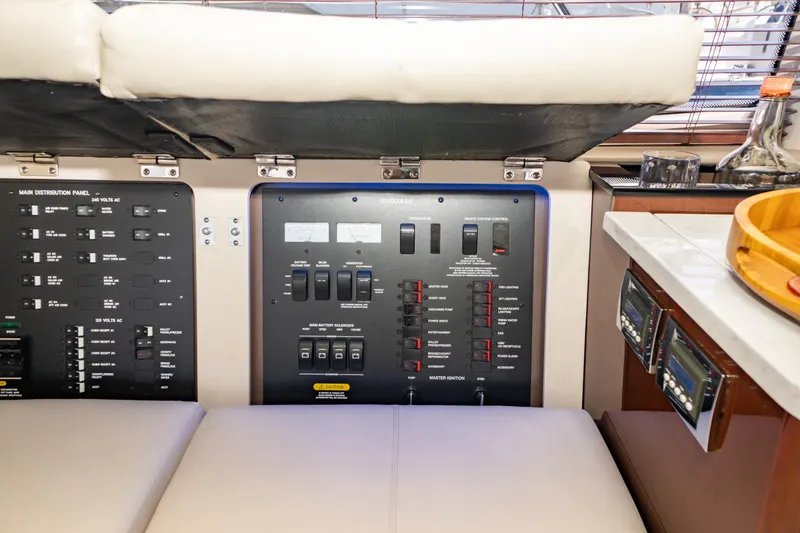 Slide: The Image of Control panel inside 2017 Sea Ray Sundancer 460 yacht, featuring switches and gauges. - 25