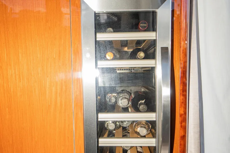 Slide: The Image of Wine cooler on 2017 Sea Ray Sundancer 460 yacht, featuring wooden and stainless steel design. - 29