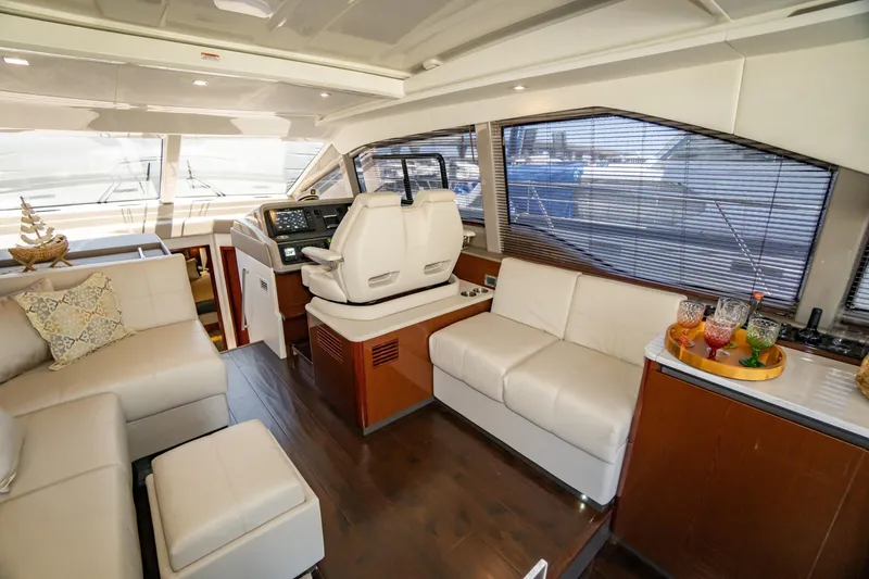 Slide: The Image of Luxurious interior of 2017 Sea Ray Sundancer 460 yacht with plush seating and helm station. - 31