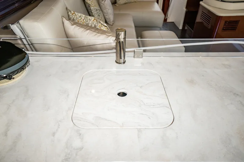 Slide: The Image of 2017 Sea Ray Sundancer 460 yacht interior with elegant marble countertop and modern faucet. - 34