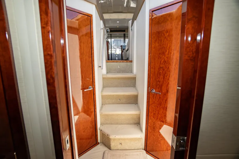 Slide: The Image of Interior of 2017 Sea Ray Sundancer 460 yacht with wooden doors and carpeted stairs. - 41