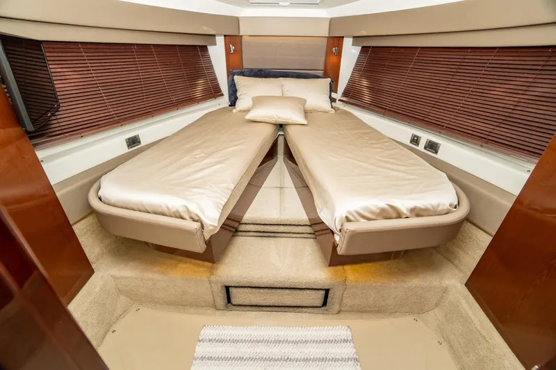 Slide: The Image of Luxurious 2017 Sea Ray Sundancer 460 cabin with twin beds and elegant wood accents. - 45