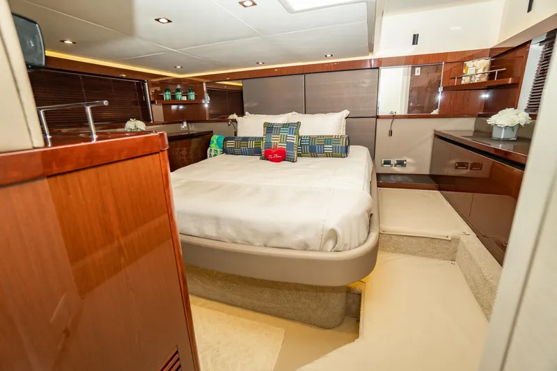 Slide: The Image of Luxurious 2017 Sea Ray Sundancer 460 yacht bedroom with elegant wood finishes and plush bedding. - 47