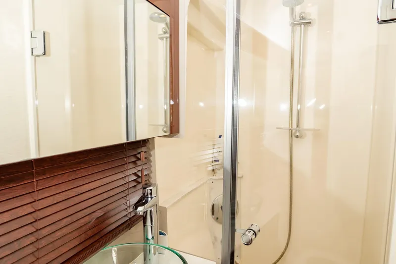 Slide: The Image of Bathroom interior of 2017 Sea Ray Sundancer 460 yacht with glass sink and shower. - 50