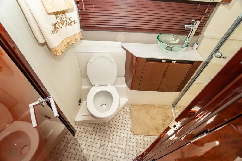 Slide: The Image of Luxurious bathroom in 2017 Sea Ray Sundancer 460 yacht with modern fixtures and elegant design. - 53