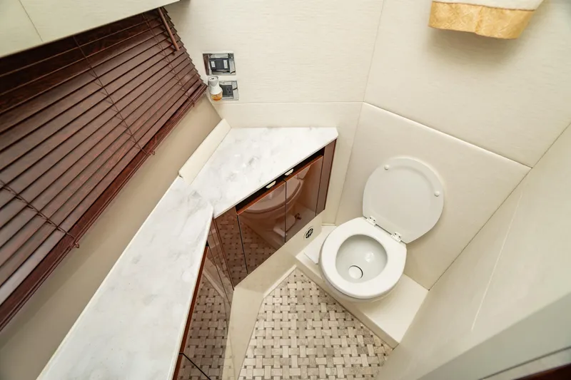 Slide: The Image of Luxurious bathroom in 2017 Sea Ray Sundancer 460 yacht with modern fixtures and elegant design. - 58