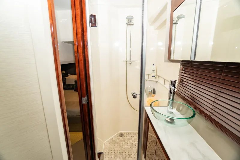 Slide: The Image of Luxurious bathroom in 2017 Sea Ray Sundancer 460 yacht with glass sink and shower. - 59