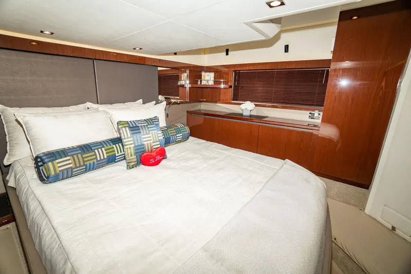 Slide: The Image of Luxurious bedroom interior of 2017 Sea Ray Sundancer 460 yacht with elegant wood finishes. - 62