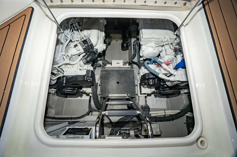 Slide: The Image of Engine compartment of a 2017 Sea Ray Sundancer 460 yacht, showcasing mechanical components. - 73