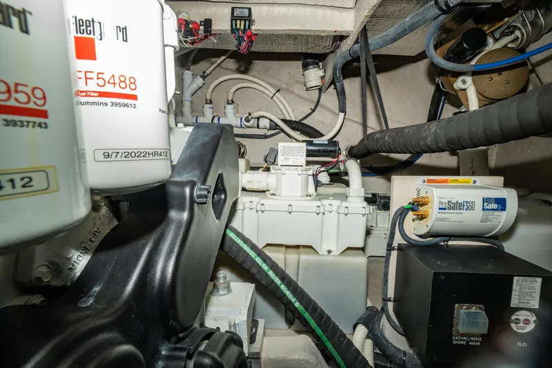 Slide: The Image of Engine room of 2017 Sea Ray Sundancer 460, showcasing mechanical components and wiring. - 74