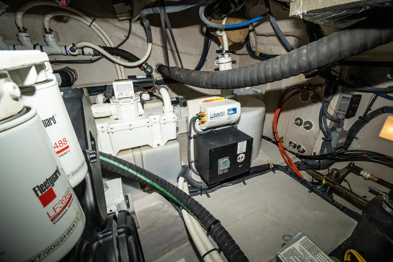 Slide: The Image of Engine room of 2017 Sea Ray Sundancer 460 with various mechanical components and wiring. - 76