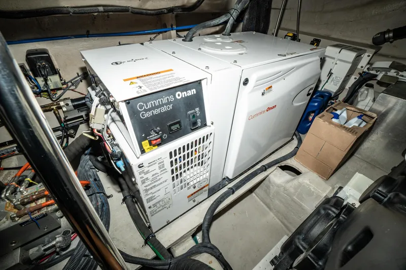 Slide: The Image of Engine room of 2017 Sea Ray Sundancer 460 with Cummins Onan generator. - 77