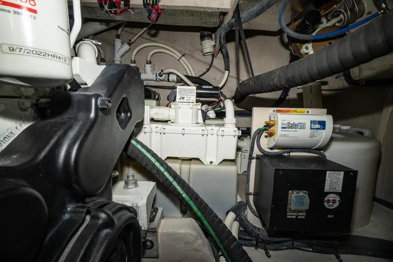 Slide: The Image of Engine room of 2017 Sea Ray Sundancer 460 with mechanical components and wiring. - 78