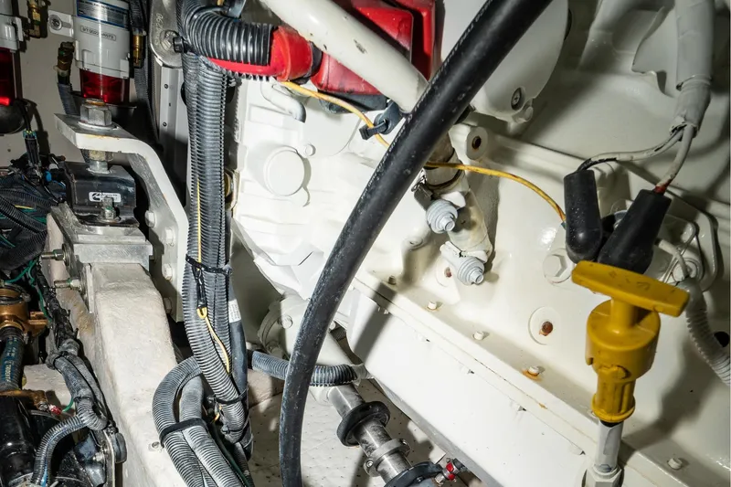 Slide: The Image of Engine room of 2017 Sea Ray Sundancer 460, showcasing wiring and mechanical components. - 84