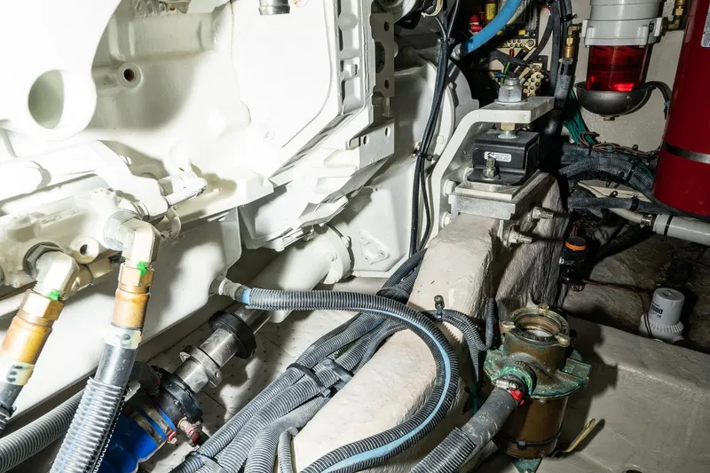 Slide: The Image of Engine room of 2017 Sea Ray Sundancer 460 with visible mechanical components and wiring. - 85