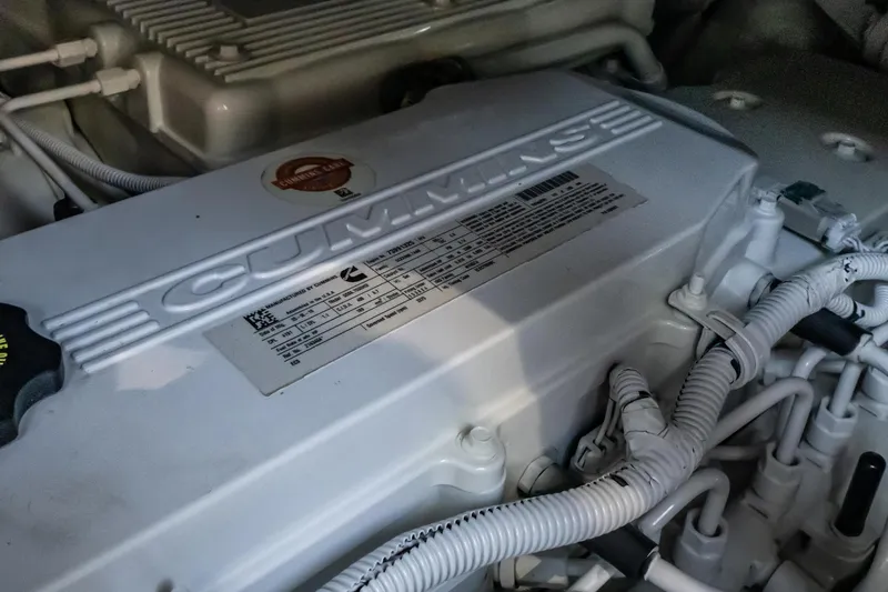 Slide: The Image of Engine compartment of 2017 Sea Ray Sundancer 460 with Cummins branding visible. - 87