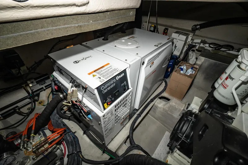Slide: The Image of Engine room of 2017 Sea Ray Sundancer 460 with Cummins Onan generator. - 90