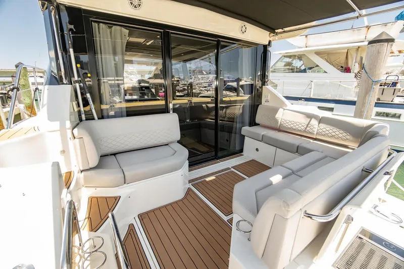 Slide: The Image of Luxurious 2017 Sea Ray Sundancer 460 yacht with elegant seating and teak flooring. - 92
