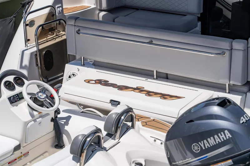 Slide: The Image of 2017 Sea Ray Sundancer 460 yacht interior with Yamaha engine, showcasing luxury seating and controls. - 95