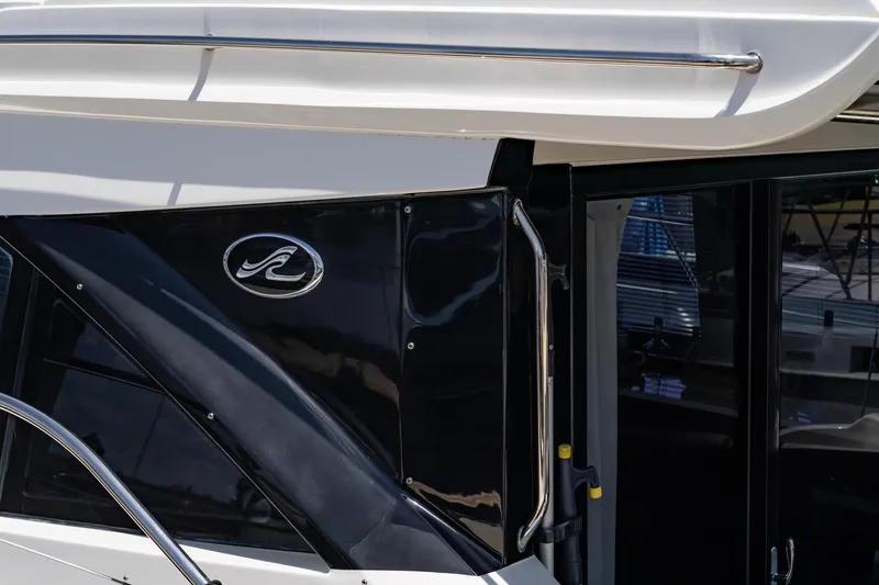 Slide: The Image of Close-up of 2017 Sea Ray Sundancer 460 yacht exterior with logo and sleek design. - 96