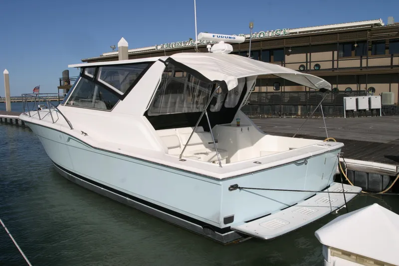 Slide: The Image of 1996 Hatteras 39 Sport Express yacht docked at marina, side view. - 15