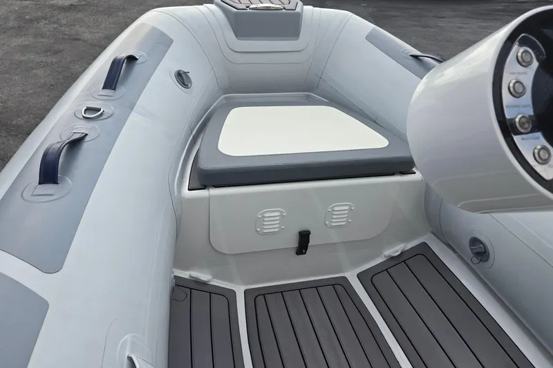 Slide: The Image of 2025 Highfield Classic 310 boat interior with seating and control panel. - 14
