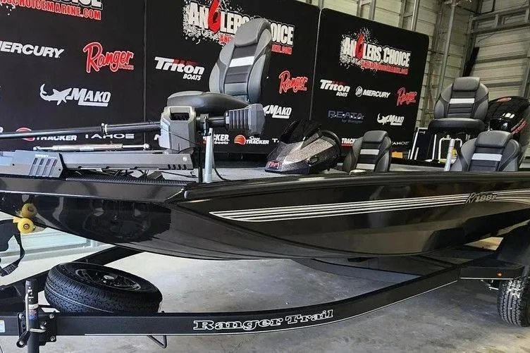 Slide: The Image of 2026 Ranger RT188P boat on trailer in showroom with branded backdrop. - 4
