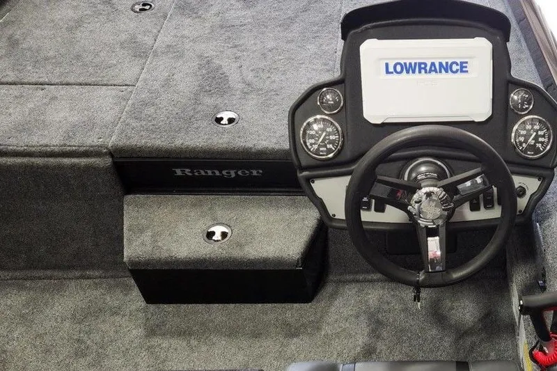 Slide: The Image of 2026 Ranger RT188P boat dashboard with Lowrance display and steering wheel. - 8