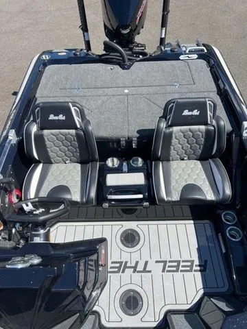 Slide: The Image of 2026 Bass Cat Cougar FTD SP boat interior with dual seats and steering wheel. - 4